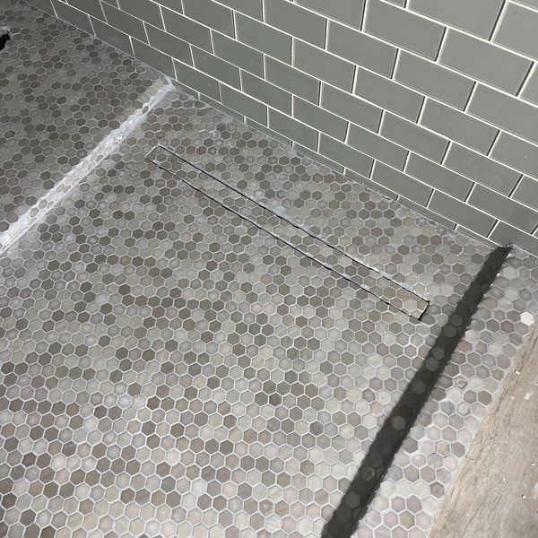 Enhancing Bathroom Aesthetics with Tie-In Drains: A Visionary Approach to Remodeling