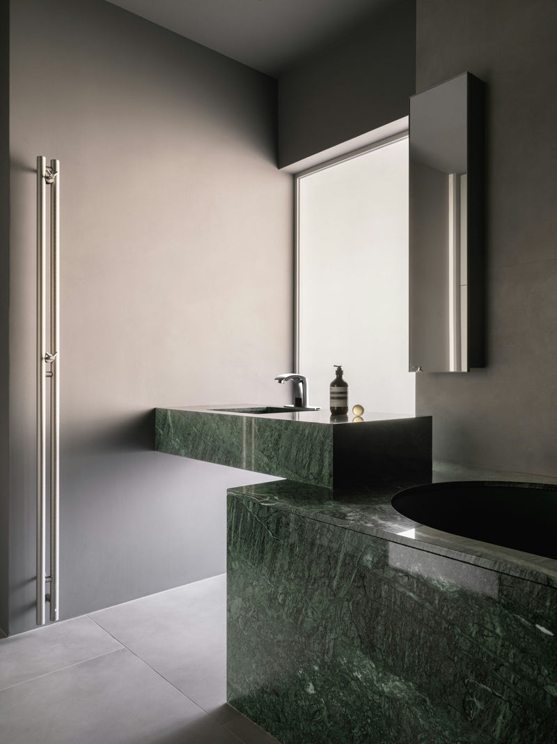 A Primsoph touchless faucet in a modern style bathroom