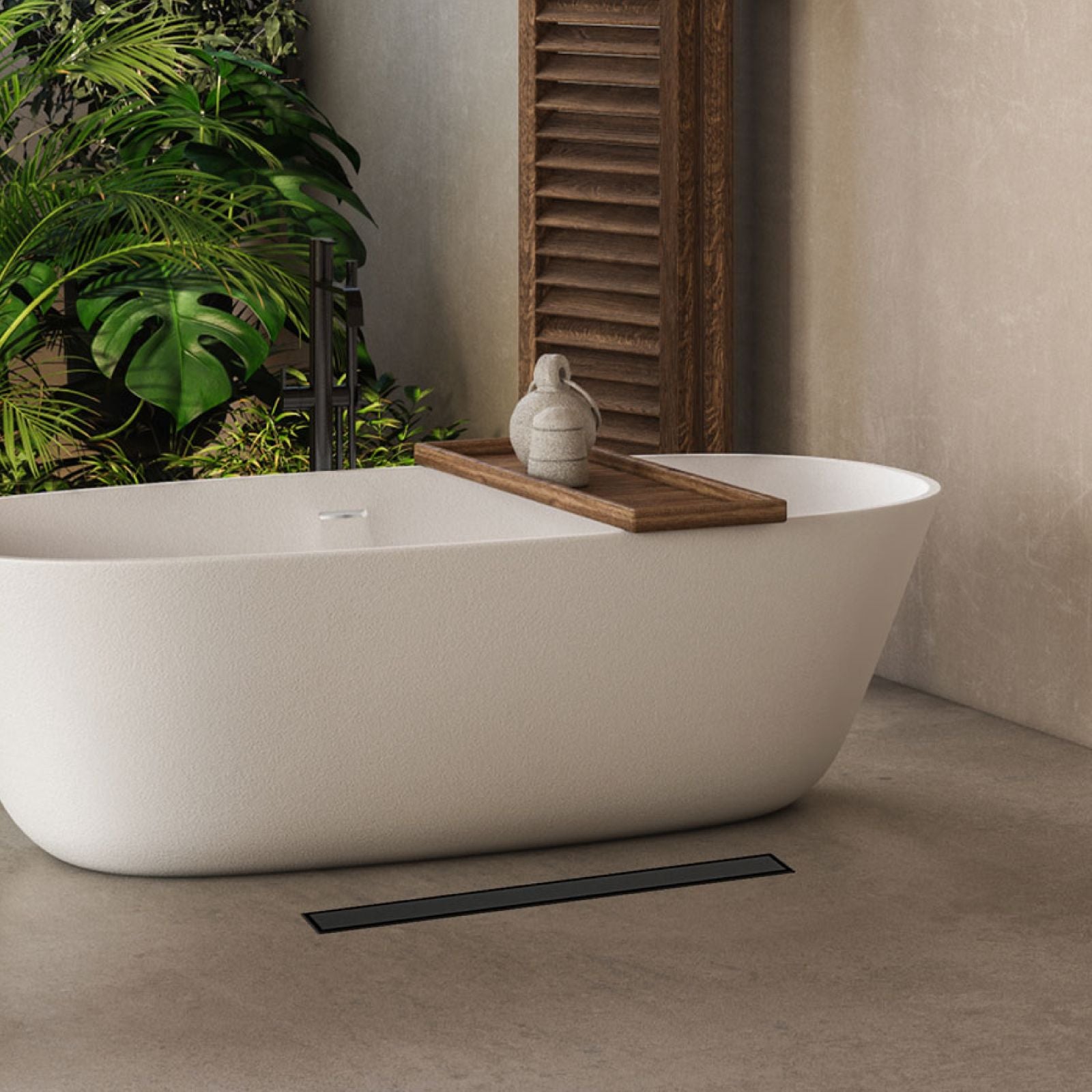 Modern white freestanding bathtub in a bathroom setting with a Webang linear drain.